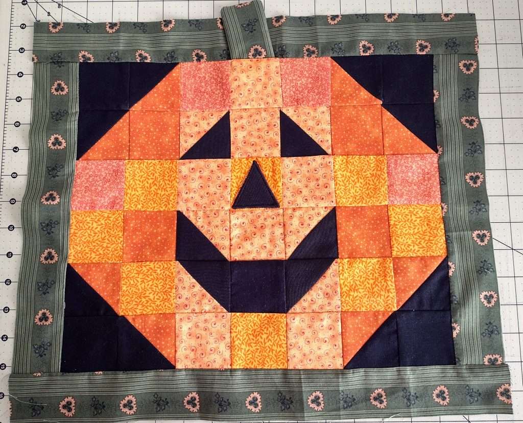 patchwork pumpkin jack-o-lantern